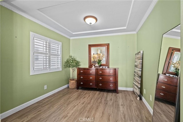 bedroom featuring crown molding and light hardwood / wood-style floors