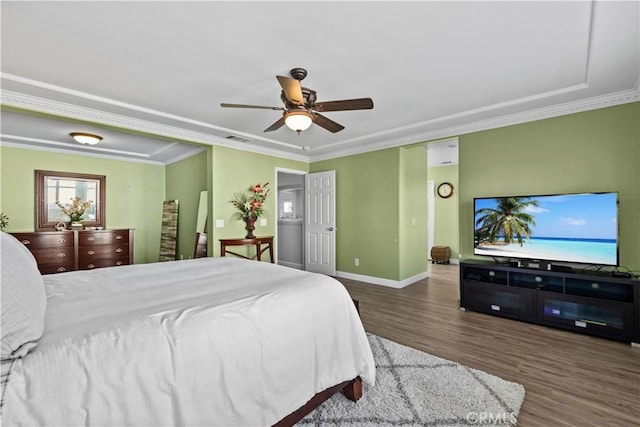 bedroom featuring dark hardwood / wood-style flooring, crown molding, and ceiling fan