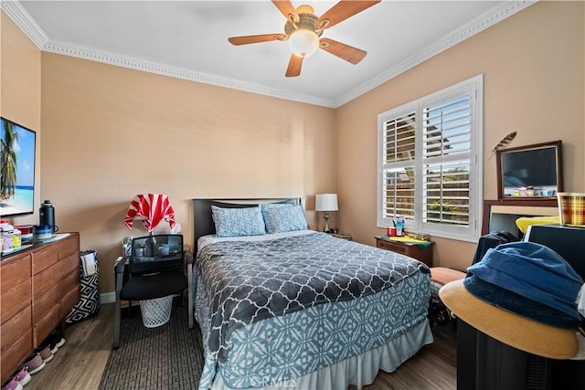 bedroom with crown molding, ceiling fan, and hardwood / wood-style floors