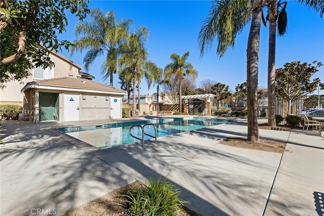 view of pool featuring a pergola and a patio