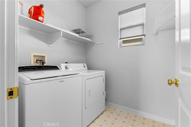 washroom featuring washing machine and clothes dryer