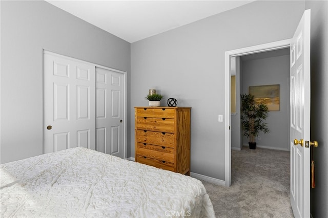 bedroom featuring light carpet and a closet