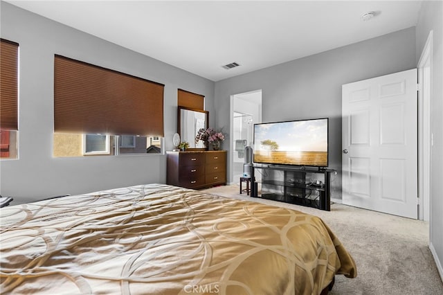 carpeted bedroom featuring multiple windows