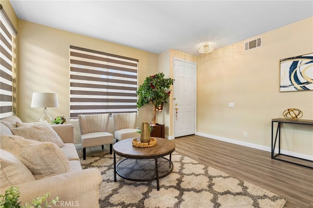 living room with a healthy amount of sunlight and hardwood / wood-style floors