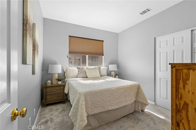 bedroom featuring light colored carpet