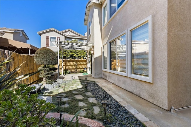 exterior space featuring a pergola and a patio area