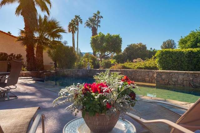 exterior space featuring a fenced in pool