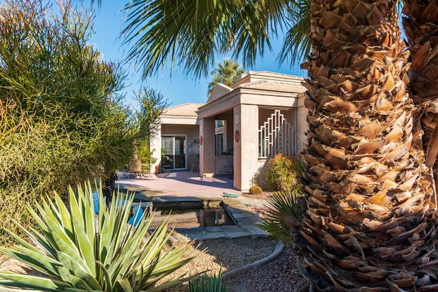 rear view of property with a patio