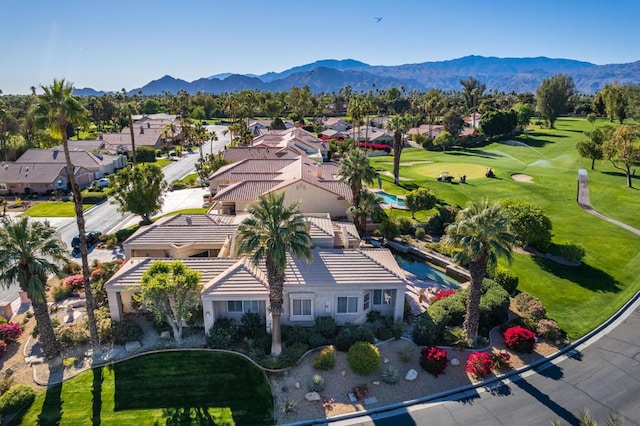 birds eye view of property with a mountain view