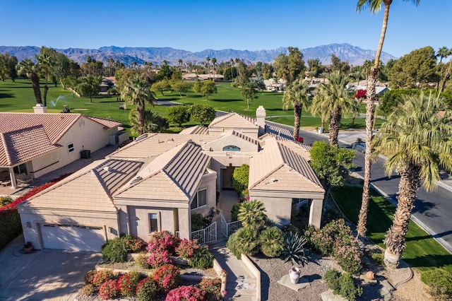 birds eye view of property featuring a mountain view