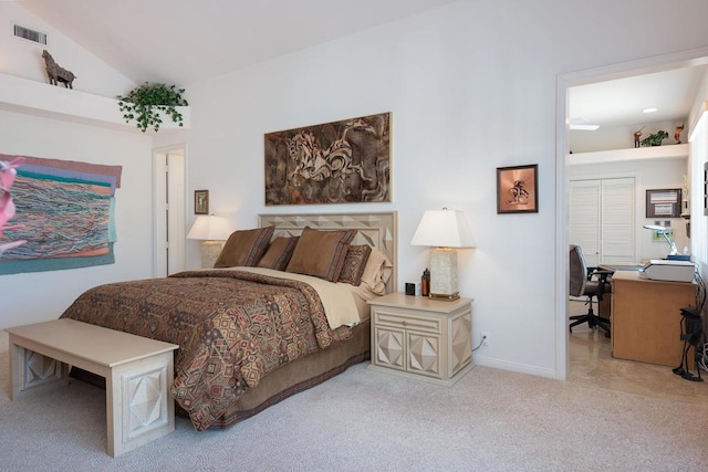 carpeted bedroom with vaulted ceiling