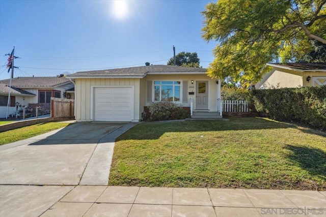 ranch-style home with a front yard and a garage