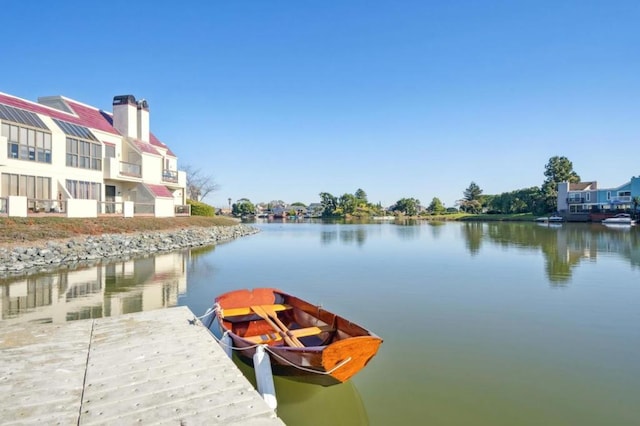 dock area with a water view