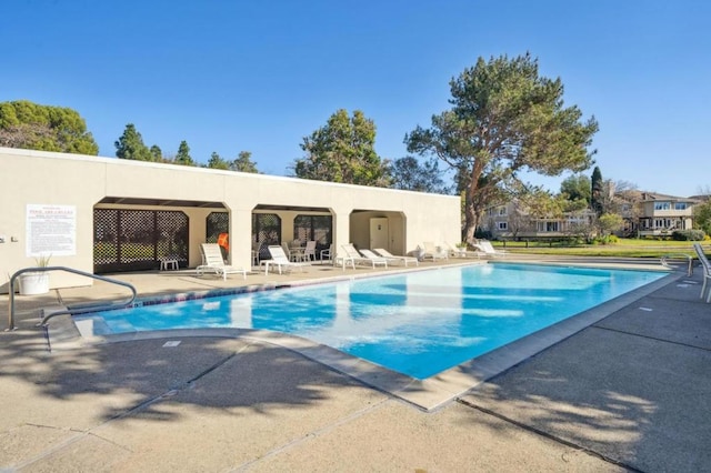 view of swimming pool featuring a patio area