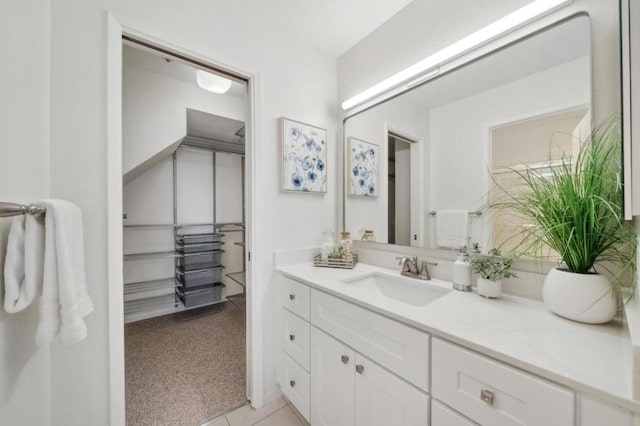 bathroom featuring tile patterned floors and vanity