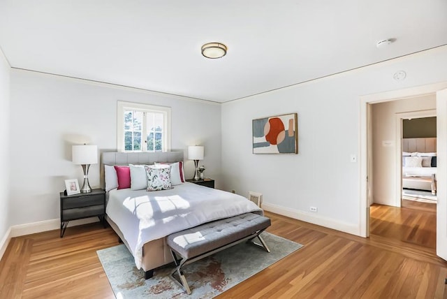 bedroom with light wood-type flooring