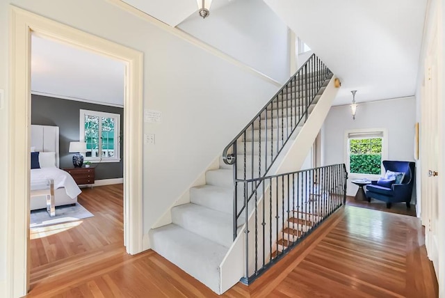 stairs with hardwood / wood-style floors