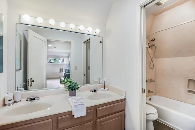 full bathroom featuring vanity, washtub / shower combination, lofted ceiling, and toilet