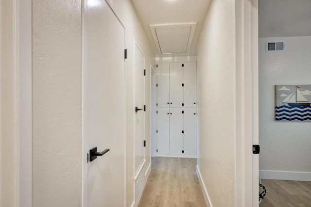 corridor featuring light hardwood / wood-style floors