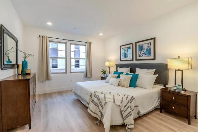 bedroom with light hardwood / wood-style flooring