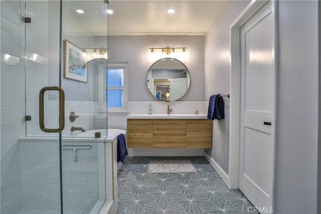 bathroom with a shower with shower door, vanity, and tile patterned flooring