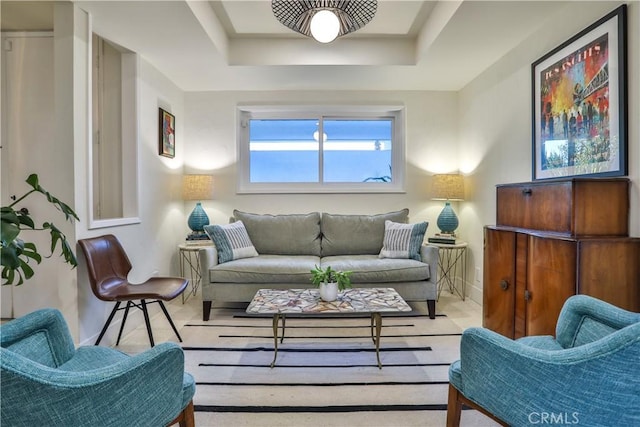 living room featuring a tray ceiling