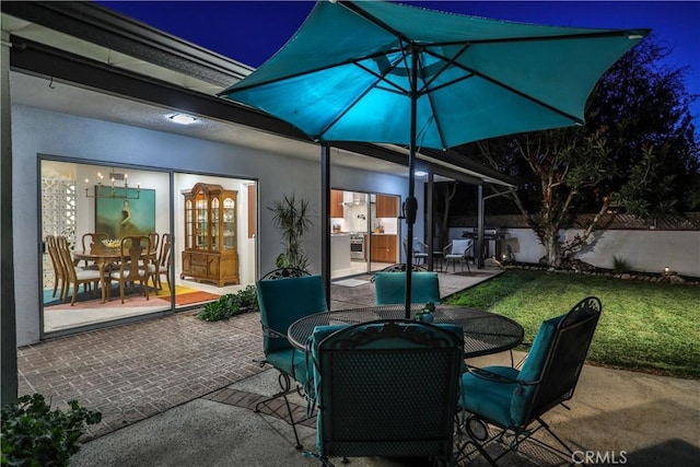 patio at twilight with a lawn