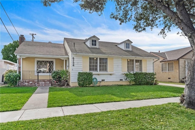 view of front of house with a front yard and a porch