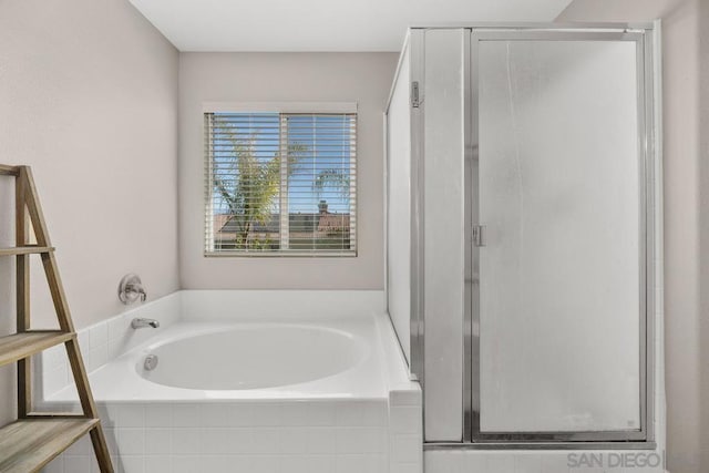 bathroom with separate shower and tub