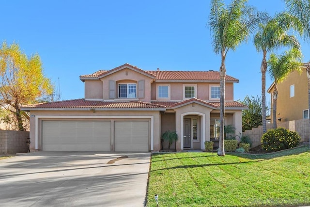 mediterranean / spanish-style house with a front lawn and a garage