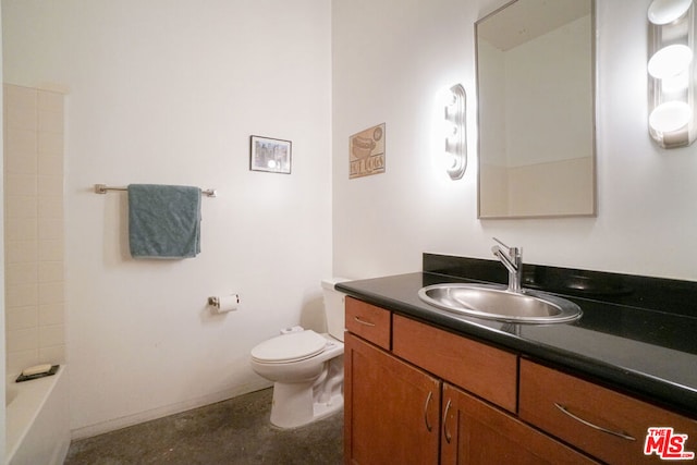 bathroom with toilet and vanity