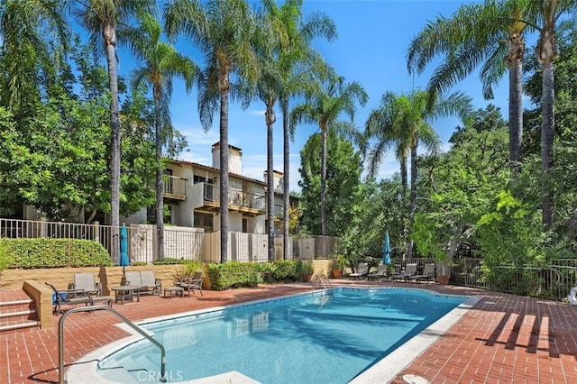 view of swimming pool with a patio