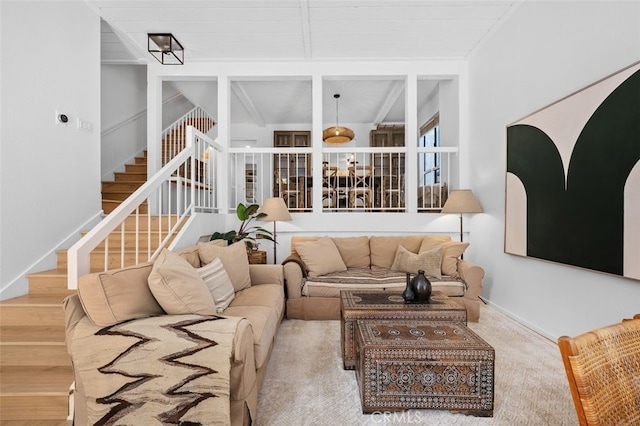 carpeted living room with lofted ceiling