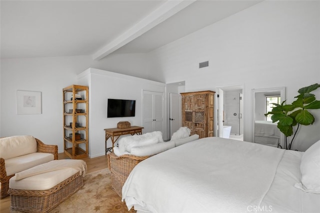 bedroom featuring ensuite bathroom, light wood-type flooring, a closet, high vaulted ceiling, and beamed ceiling