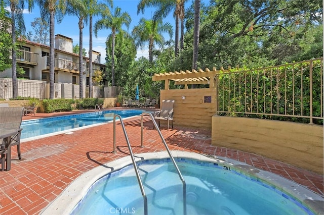 view of pool featuring a hot tub