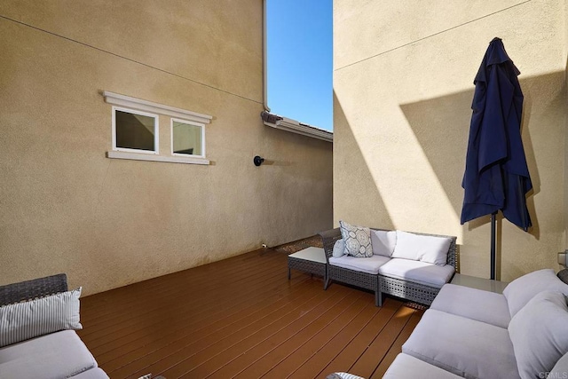 wooden deck featuring an outdoor living space