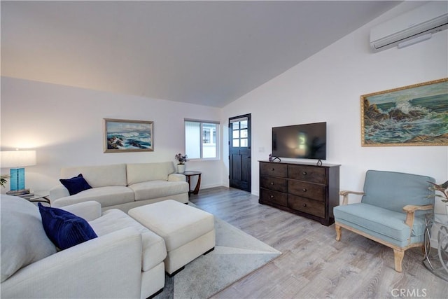 living room with a wall unit AC, vaulted ceiling, and light wood-type flooring