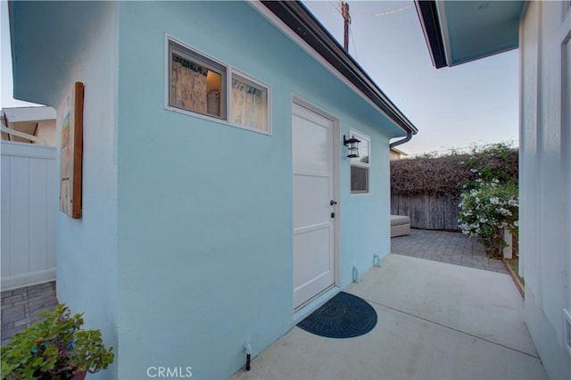 property entrance featuring a patio area