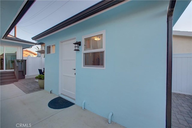 entrance to property featuring a patio area