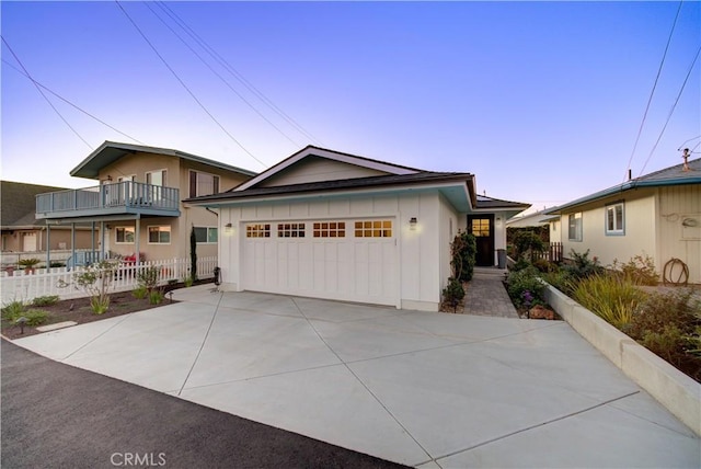 29 11th St, Cayucos, CA 93430 - view of front of house featuring an attached garage, board and batten siding, and concrete driveway