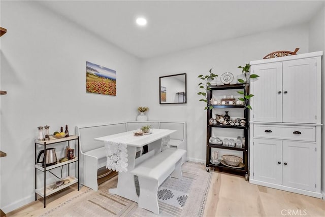 dining area with light hardwood / wood-style floors