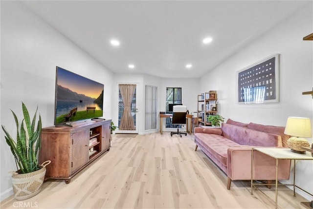 living room with light hardwood / wood-style floors and french doors