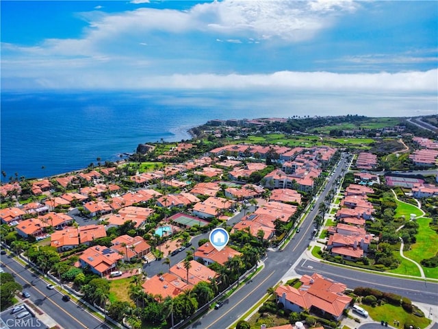 drone / aerial view featuring a residential view and a water view