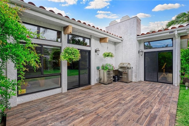 wooden deck featuring grilling area