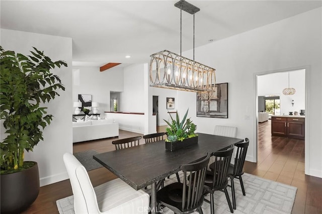 dining room featuring recessed lighting, wood finished floors, and baseboards