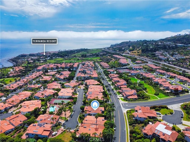 birds eye view of property featuring a water view and a residential view