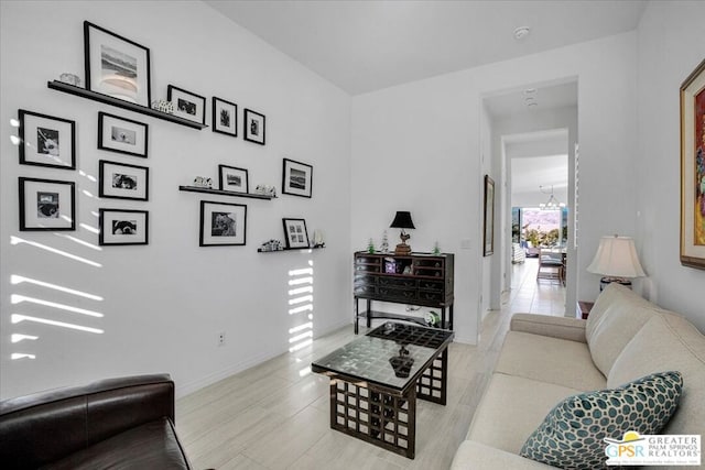 living room with a notable chandelier