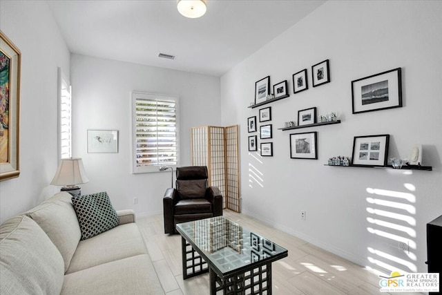 living room with light hardwood / wood-style flooring