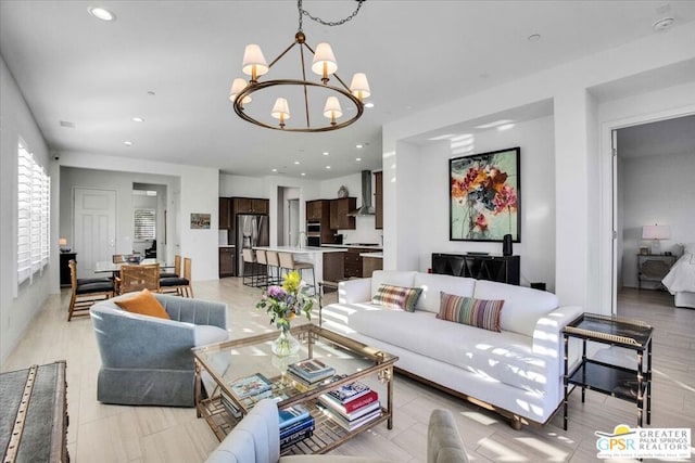 living room with an inviting chandelier