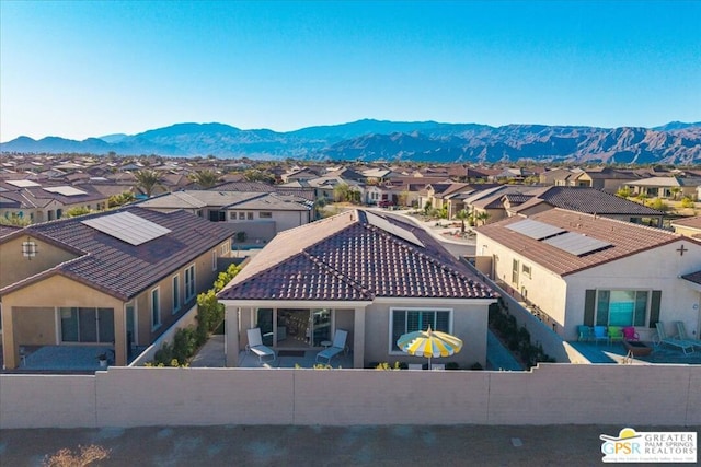 birds eye view of property featuring a mountain view